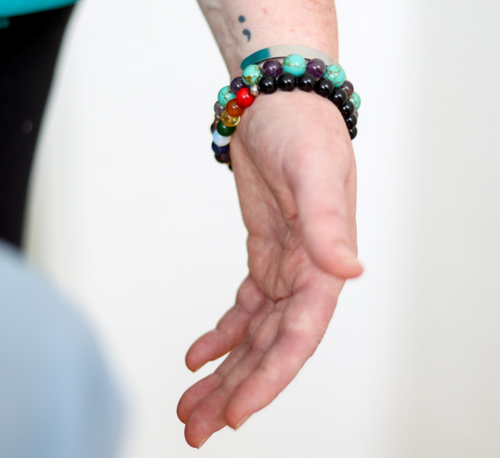 Hand with semi colon tattoo